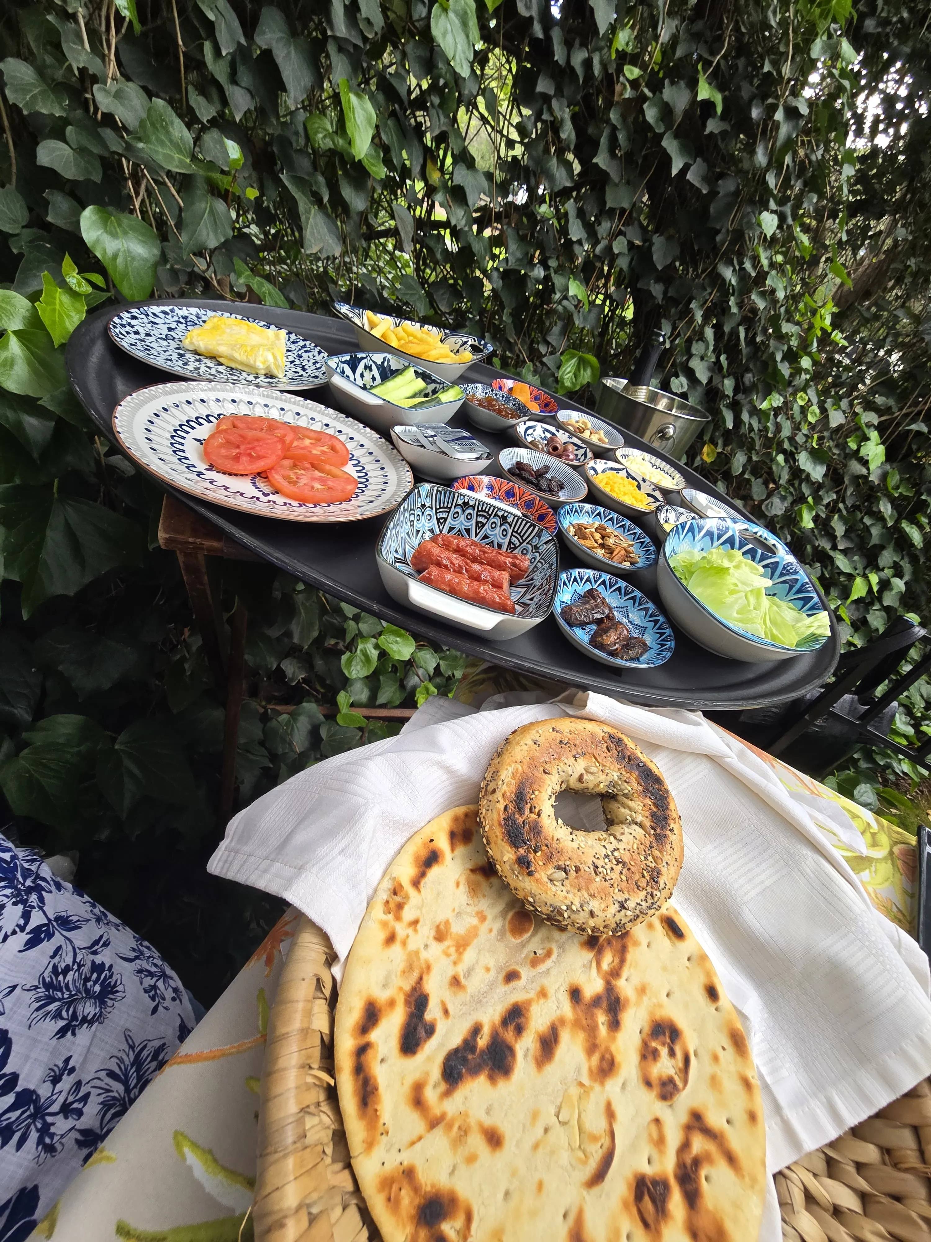 A breakfast spread on a garden table at MelonRouge